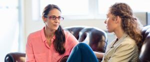 a person talks to a therapist about levels of care