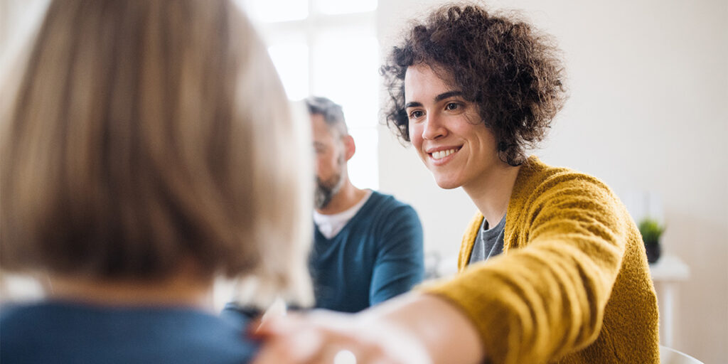 a person supports another in a support group for spiritual health at meadows counseling center