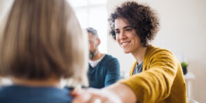 a person supports another in a support group for spiritual health at meadows counseling center